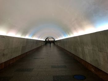 Man walking in subway tunnel