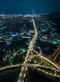 High angle view of illuminated cityscape at night