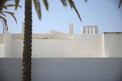 Low angle view of white building against blue sky