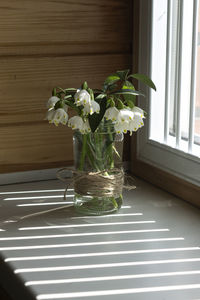 Flower vase on table at home