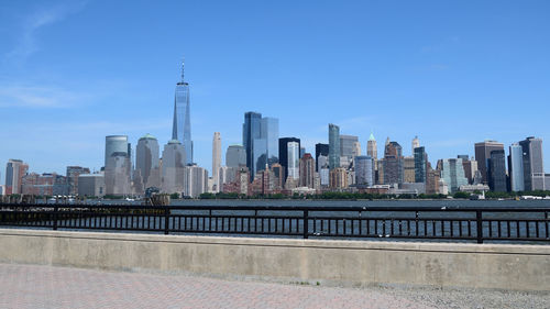 Modern buildings in city against sky