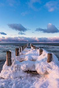 Scenic view of sea against sky during winter