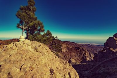 Scenic view of mountains against clear blue sky