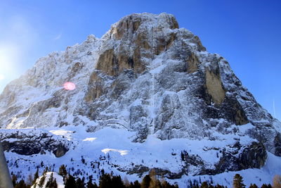Scenic view of mountains against blue sky