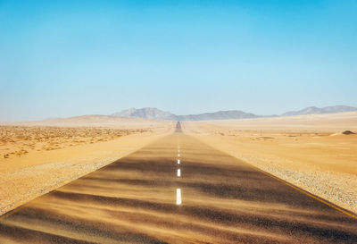 Scenic view of road against clear sky