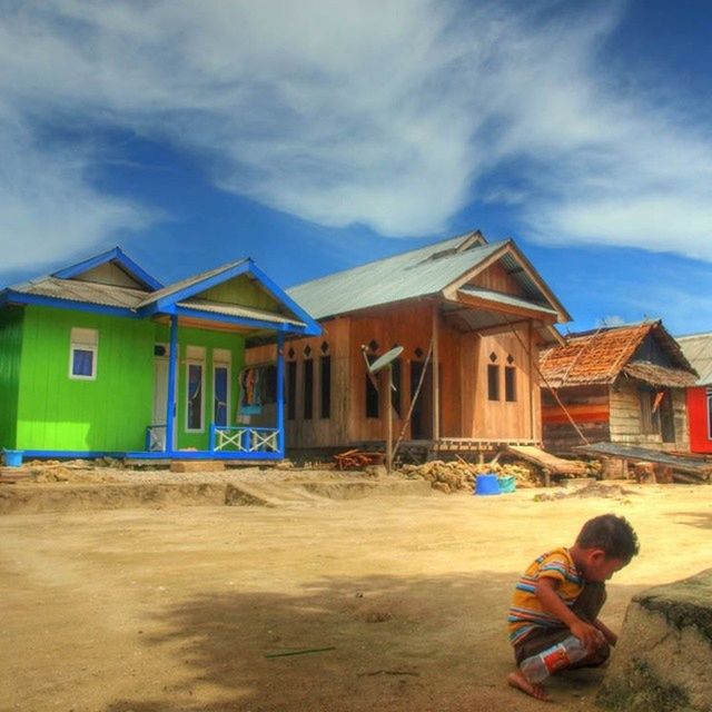 building exterior, sky, architecture, built structure, cloud - sky, house, cloud, cloudy, residential structure, lifestyles, day, childhood, blue, residential building, leisure activity, outdoors, multi colored, casual clothing