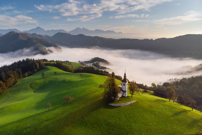 Scenic view of landscape and mountains against sky