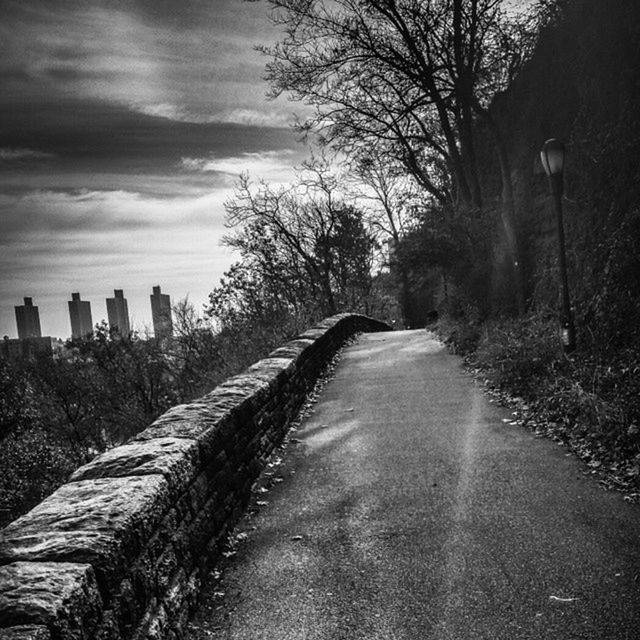 the way forward, diminishing perspective, tree, sky, vanishing point, tranquility, bare tree, tranquil scene, nature, long, road, landscape, cloud - sky, empty road, transportation, dirt road, no people, empty, narrow, outdoors