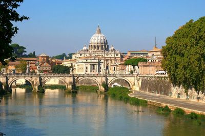 View of bridge over river in city