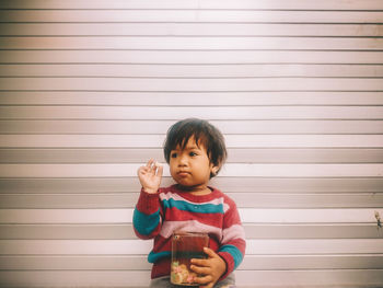 Portrait of cute child with candy