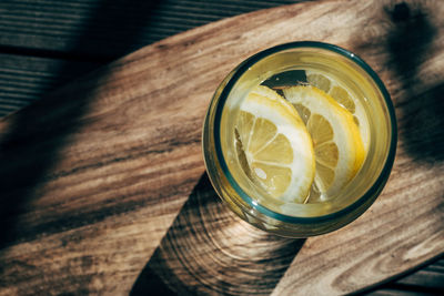 High angle view of lemon slices in drink on table