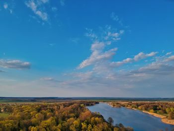 Scenic view of landscape against blue sky