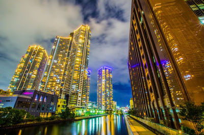 Illuminated buildings in city at night