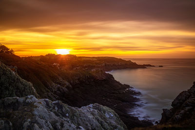 Scenic view of sea against sky during sunset