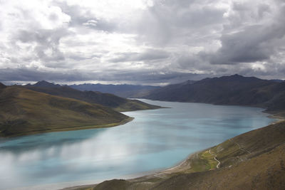 Scenic view of lake and mountains against sky