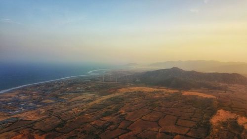 High angle view of landscape and sea against sky, nam cuong sand dune, ninh thuan province, vietnam