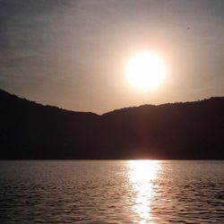 Scenic view of lake at sunset