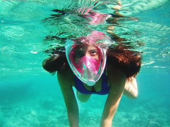 Portrait of woman swimming in sea