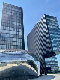 Low angle view of modern building against clear sky