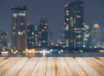 Defocused image of illuminated city at night