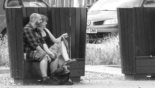 Young woman sitting outdoors