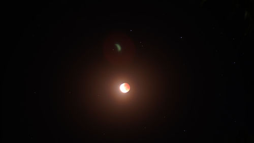 Low angle view of moon against sky at night