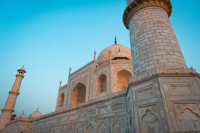 Low angle view of taj mahal under blue sky