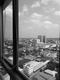 View of cityscape through window