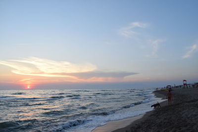 Scenic view of beach at sunset