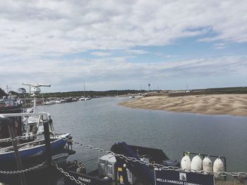 Boats moored at harbor