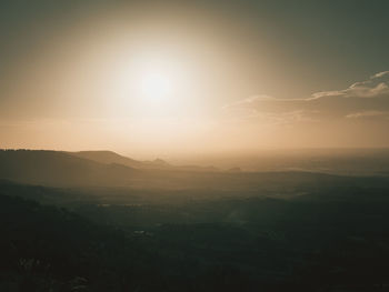 Aerial view of townscape against sky during sunset