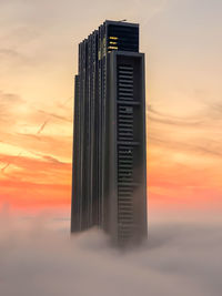 Low angle view of building against sky during sunset