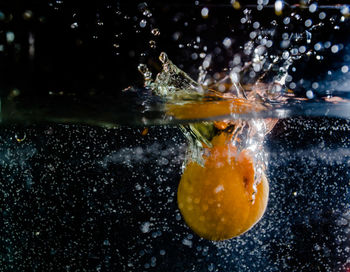 Fruit splashing in water