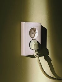 Socket on the green wall