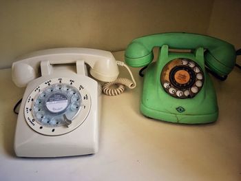 Close-up of old rotary phones on table