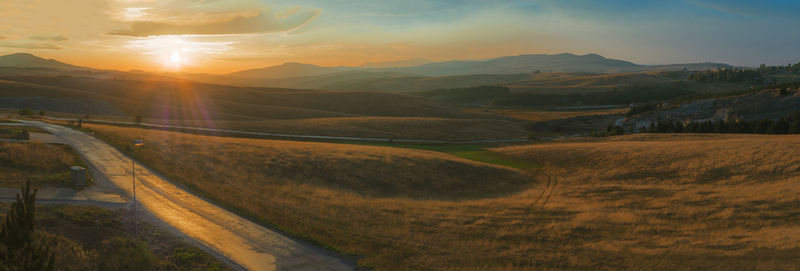 Scenic view of landscape against sky during sunset