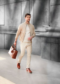 Low section of young woman standing in bathroom