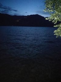 Scenic view of sea against sky at night