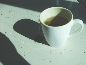 Close-up of coffee cup on table