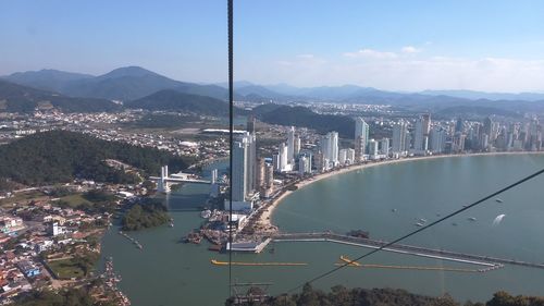 Aerial view of city buildings at waterfront