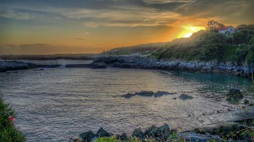 Scenic view of sea against sky during sunset