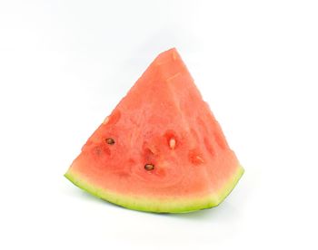 Close-up of fruit against white background