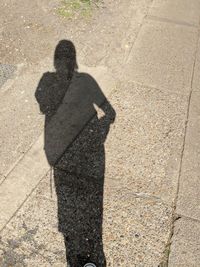 Shadow of man on street