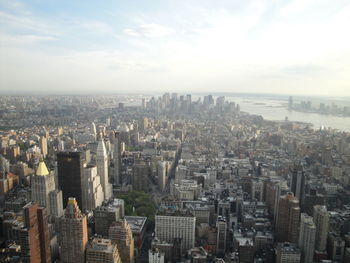 High angle view of buildings in city against sky