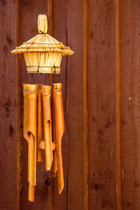 Close-up of food hanging on wooden surface