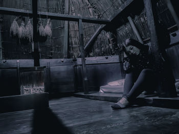 Woman standing in corridor of building