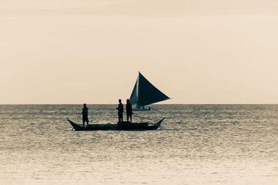 Scenic view of sea against clear sky during sunset