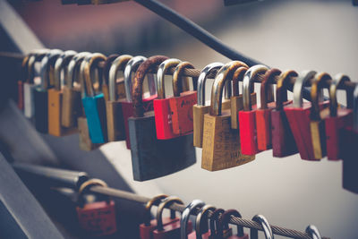 Close-up of padlocks hanging on cable