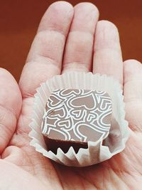 Close-up of hand holding ice cream