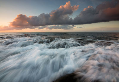 Scenic view of sea against sky during sunset